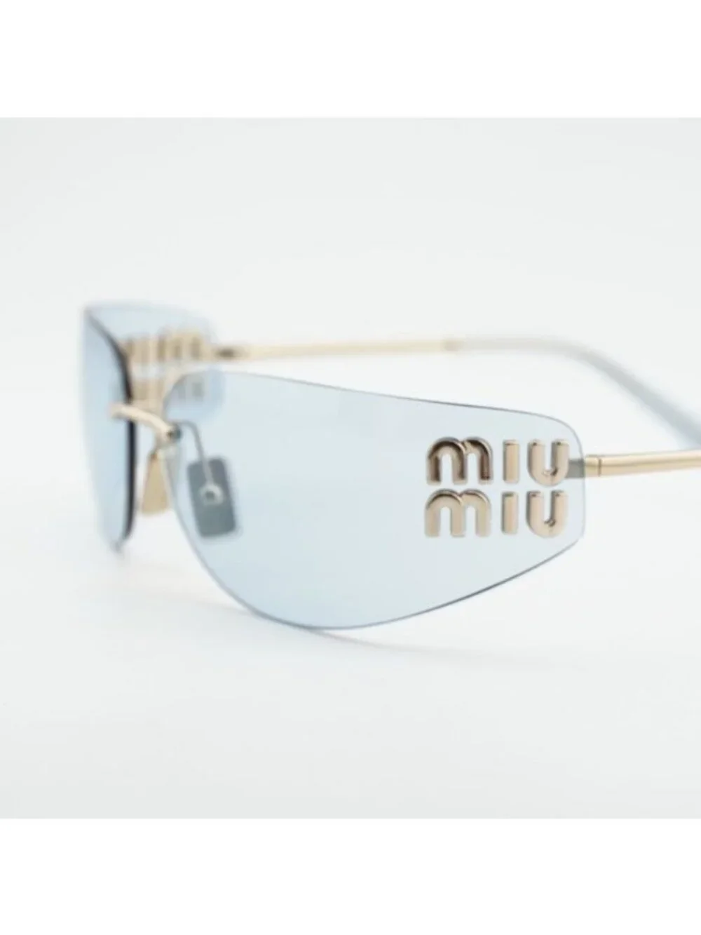 Miu Miu MUA51S ZVN10P Sunglasses Pale Gold Rectangle Frame, Light Blue Lenses